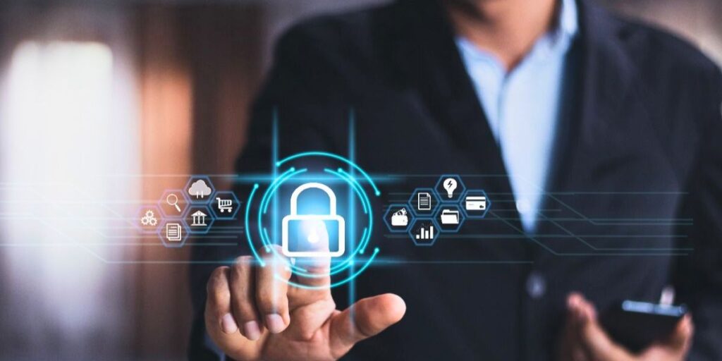 A person in a suit touches a glowing digital padlock icon surrounded by security and commerce icons